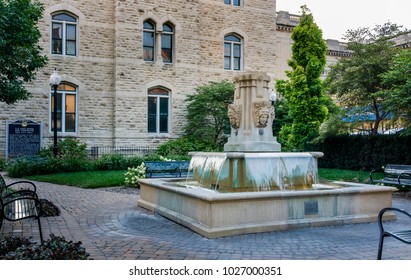Nebraska, USA - Aug 8, 2017: Courtyard of Government Square in Lincoln, with ornate fountain. This site was the historic U.S. Post Office and Courthouse or Old City Hall.