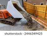It is necessary to pour wet cement into framework from concrete buggy using self dumping track concrete buggy during construction of foundation