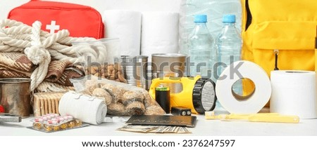 Necessities for emergency bag on light background [[stock_photo]] © 