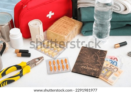 Necessities for emergency bag on white table, closeup Сток-фото © 