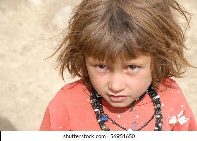 NECHEM, AFGHANISTAN - MAY 28: Unidentified Child Eyes The Camera Suspiciously On May 28, 2010 In Nechem, Afghanistan. Childhood Mortality Has Fallen Here Since A UN Nutrition Program Began.