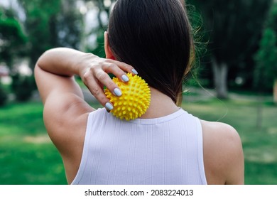 Neck Massage With Spiky Yellow Massage Ball For Muscle Pain Relieve And Myofascial Release. 