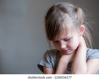 Neck Pain. Portrait Stressed Unhappy Child Girl With Back Pain,  Negative Human Emotions Facial Expression Feeling. 