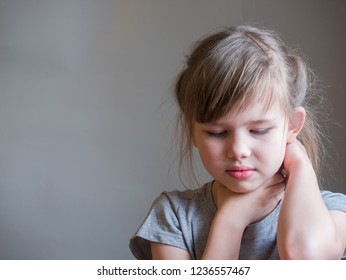 Neck Pain. Portrait Stressed Unhappy Child Girl With Back Pain,  Negative Human Emotions Facial Expression Feeling. 