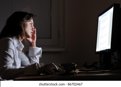 Neck Pain - Young Tired Business Woman Working Overtime At Computer, Night Setting