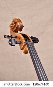 A neck and scroll of the cello