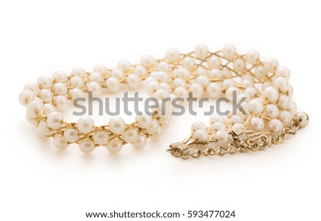 Necklace with golden chain and white beads