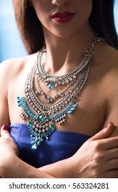 necklace on the neck. ruby and emerald