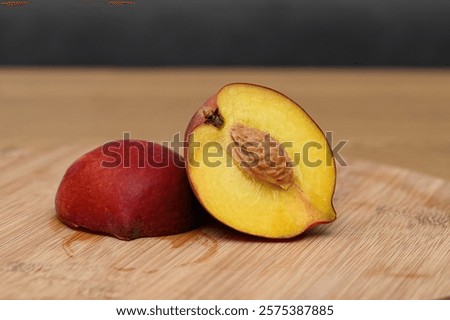 Nectarine cut in half, fruit with stone