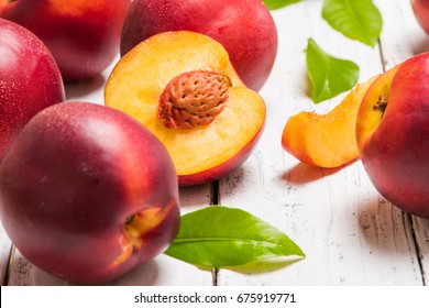 Nectarines on a light wooden background