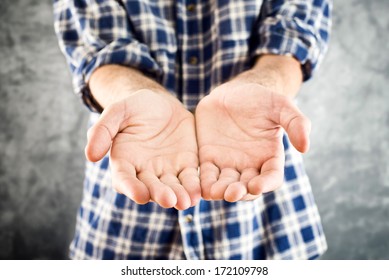 Need help/ Cupped hands hopefully held up, asking for help or charity