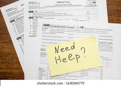 Need Help Text On Sticker With Blank 1040 Tax Return U.S. IRS Form. Tax Season.