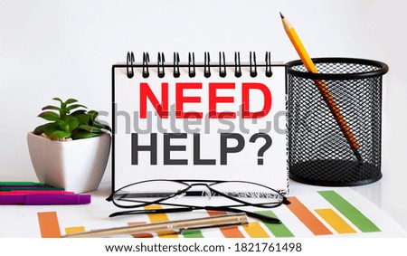 NEED HELP word with Notepad white background with markers ,charts and glasses