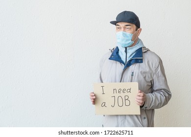 Need A Job, Asian Unemployed Adult Male In A Mask With Poster. Unemployment, Loss Job From Coronavirus Crisis COVID-19.