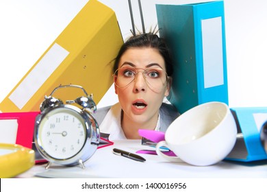 Need More Time. Young Woman Getting A Lot Of Work And Deadline, Being Under The Pressure Of The Deals. Pressed By Folders With Papers. Concept Of Office Worker's Troubles, Business, Problems And