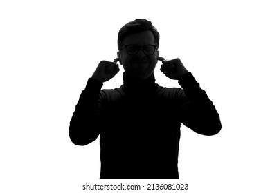 I need silence. Frustrated young man covering ears with hands - Powered by Shutterstock