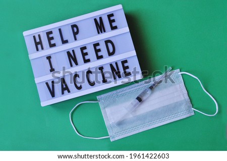 Need for vaccine. The inscription Help me, I need vaccine.On green background inscription, medical mask,syringe