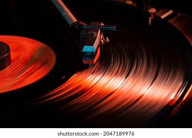 Needle Detail On Vinyl Record On Turntable, Low Light Image With Reflection