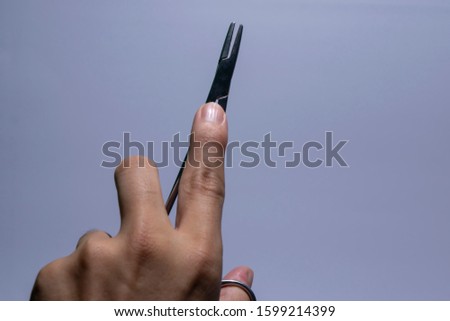 Similar – Mano negra Hand Finger