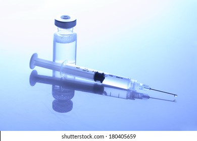 Needle And Injection In Bottle 