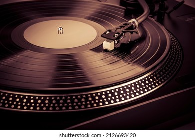 A needle on a turntable that plays music - Shutterstock ID 2126693420