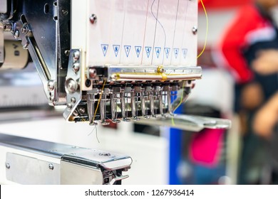 Needle and thread of modern and automatic high technology sewing or embroidery machine for textile - clothing apparel making manufacturing process in industrial