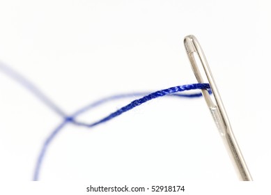 Needle And Thread On White Background