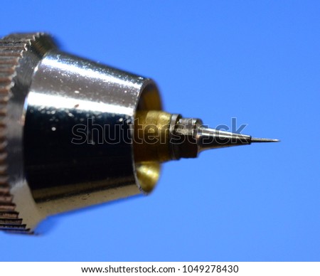 Needle tip of an airbrush. Approximate view of technical detail.
