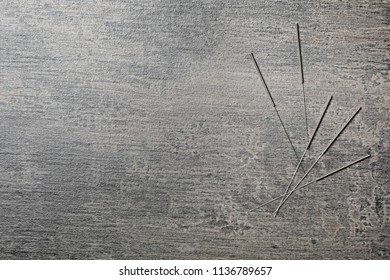 Needles For Acupuncture On Dark Background, Top View