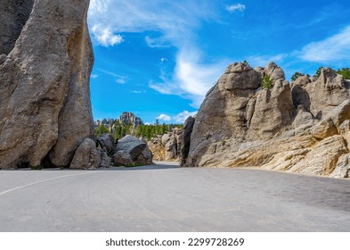 The Needles Highway is a spectacular drive through pine and spruce forests, meadows surrounded by birch and aspen, and rugged granite mountains. Part of Peter Norbeck Scenic Byway.
