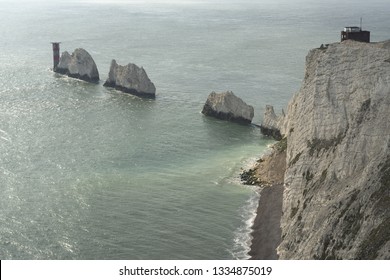 The Needles is a row of three distinctive stacks of chalk that rise about 30m out of the sea off the western extremity of the Isle of Wight, United Kingdom, close to Alum Bay, and part of Totland.