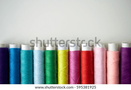 Similar – Image, Stock Photo Spool of thread on a blue jeans