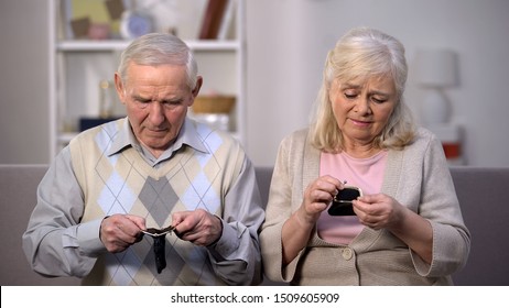 Needy Retired Couple Looking Empty Purse, Pension Poverty, Financial Crisis