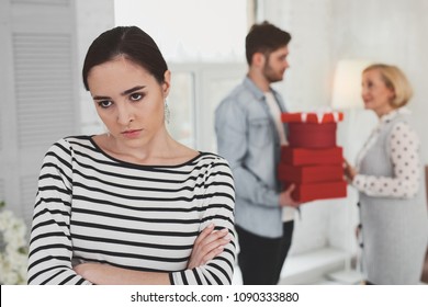 Negative Emotions. Angry Unhappy Woman Standing Cross Handed While Thinking About Her Mother In Law