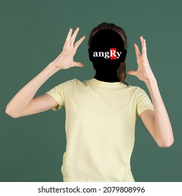 Negative emotions. Contemporary artwork. Portrait of faceless girl with word angry instead face isolated on green background. Human psychology, character traits, mental health concept. - Shutterstock ID 2079808996