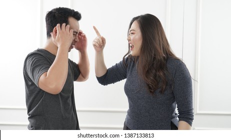
Negative emotions of couples concept. Asian People in the fight. Husband and wife arguing and yelling expressive and emotional couple having an argument - Powered by Shutterstock