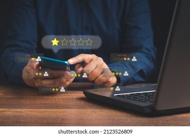 Negative feedback concept. Choosing 1-star rating review in the survey, poll, or customer satisfaction research. Bad user experience via a smartphone. Customer experience dissatisfied. Poor rating - Shutterstock ID 2123526809