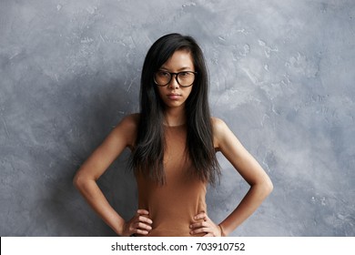 Negative Human Expressions, Emotions, Madness, Fury, Contempt And Anger Concept. Angry Arrogant Young Chinese Female With Long Black Hair Holding Hands On Her Waist, Looking Cocky And Defiant