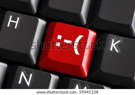 negative smilie on red computer keyboard button showing bad feelings concept