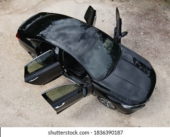Negeri Sembilan, Malaysia - Oct 3, 2020: Top view of the new Honda Accord with all four doors open, on sandy ground
