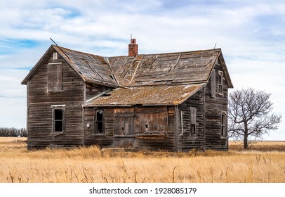 Neglected abandon barn. Dilapidated farm house - Shutterstock ID 1928085179