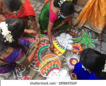 Negombo, Sri Lanka - January 20 2021: Girls Are Drawing Pictures In The Hindu New Year Festival (thai Pongal Kolam Arts)