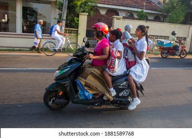 Negombo, Sri Lanka-March 25, 2019: Sri Lankan Mother And School Going Kids Riding On A Scooty At Negombo, Srilanka. 