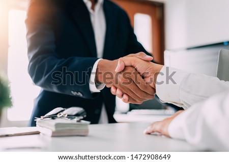 Negotiating business,Image of businessmen Handshaking,Handshake Gesturing People Connection Deal Concept