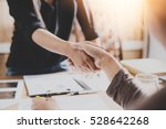 Negotiating business,Image of businesswomen Handshaking,happy with work,the woman she is enjoying with her workmate,Handshake Gesturing People Connection Deal Concept