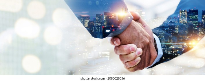 negotiation. double exposure image of investor business man handshake with partner for successful meeting deal with during sunrise and cityscape background, investment, partnership, teamwork concept