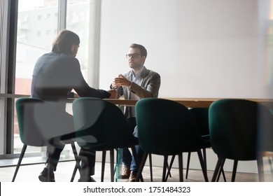Negotiations process behind wall door concept, human resources manager interviewing candidate of company position, two businessmen business meeting, insurance broker makes offer deal with firm client