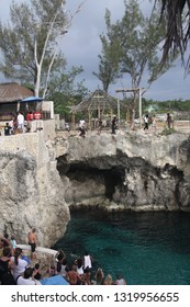 NEGRIL (RICK´S CAFE), JAMAICA - MAY 27. 2010: Cliff Diving Into Blue Lagoon From Height 8 To 40 Feet