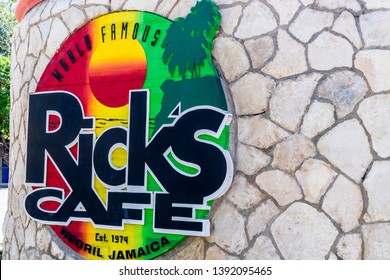 Negril, Jamaica - February 15, 2019: Sign At Brick Wall Entrance To Ricks Cafe, A Famous Sports Bar And Restaurant On The Cliffs Of West End Negril In Westmoreland, For Cliff Diving And Sunset Views.