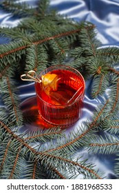 Negroni Cocktail Against The Background Of The Christmas Tree
